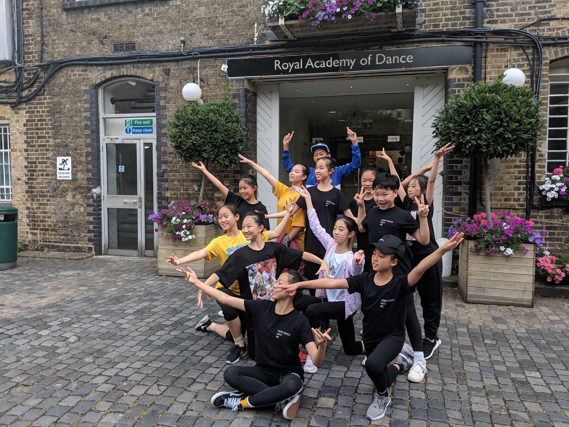 Here Dance students striking dance poses outside the Royal Academy of Dance in London