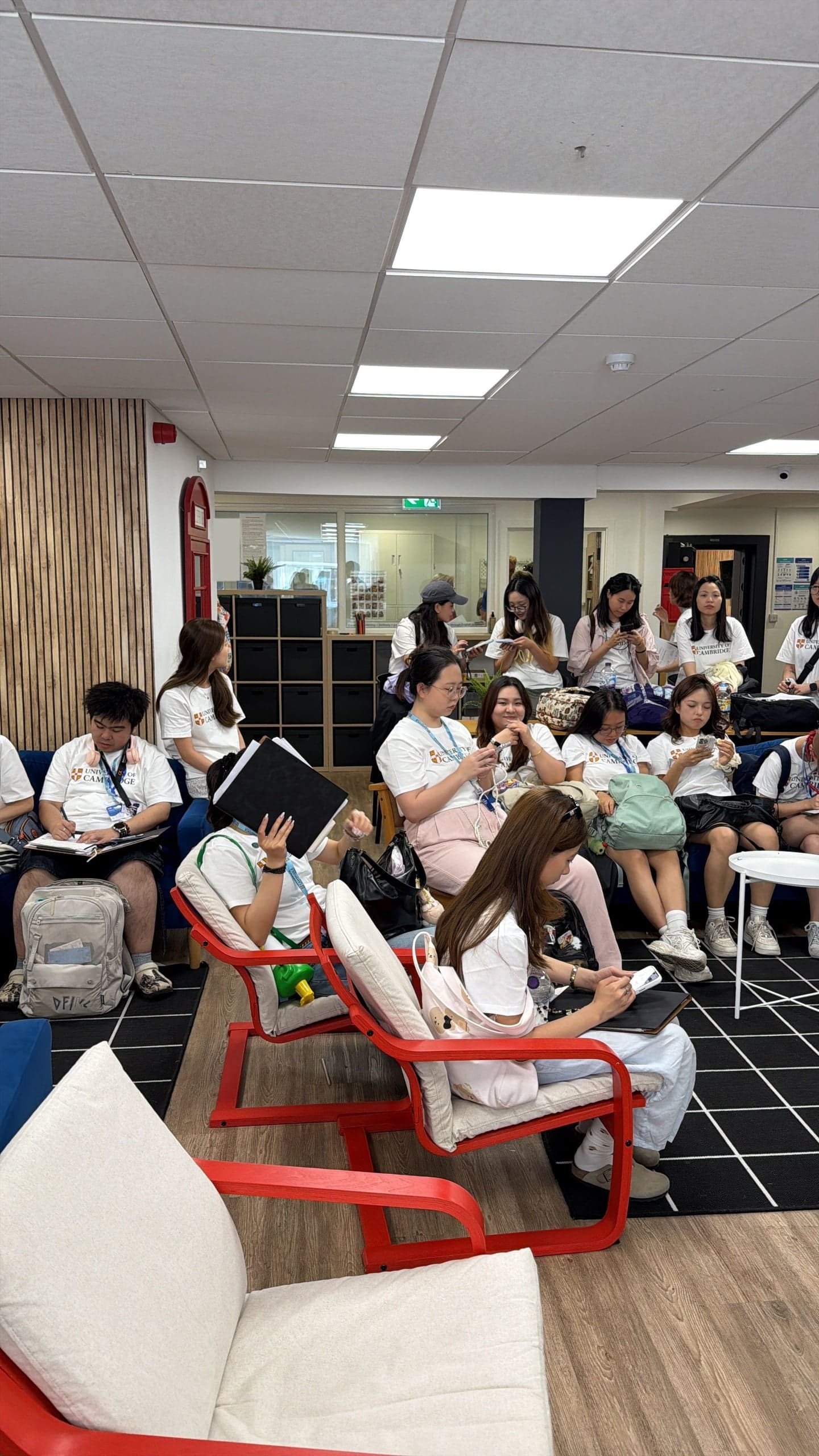 Teachers trying out a classroom activity together in a workshop room